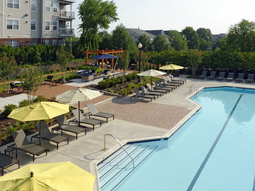 Swimming pool and sundeck with lounge seating