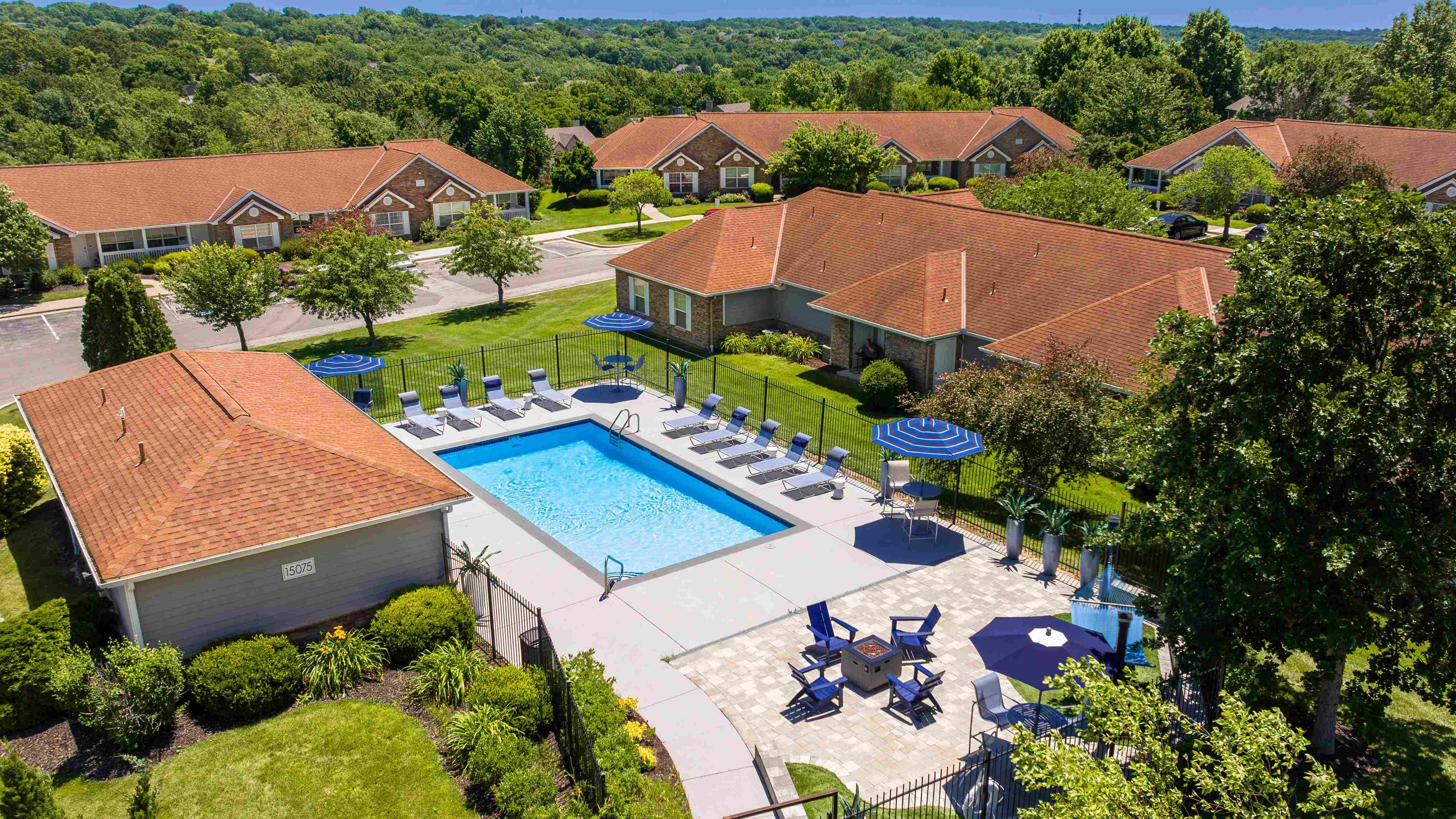 Experience our serene pool area complete with comfortable lounge chairs, shaded seating, and a cozy fire pit for perfect relaxation and socializing.