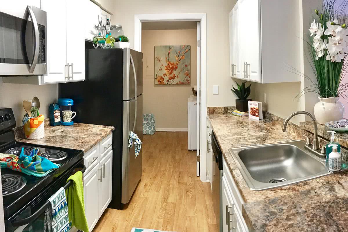 Beautiful stainless steel appliances and marble style countertops included in every kitchen.