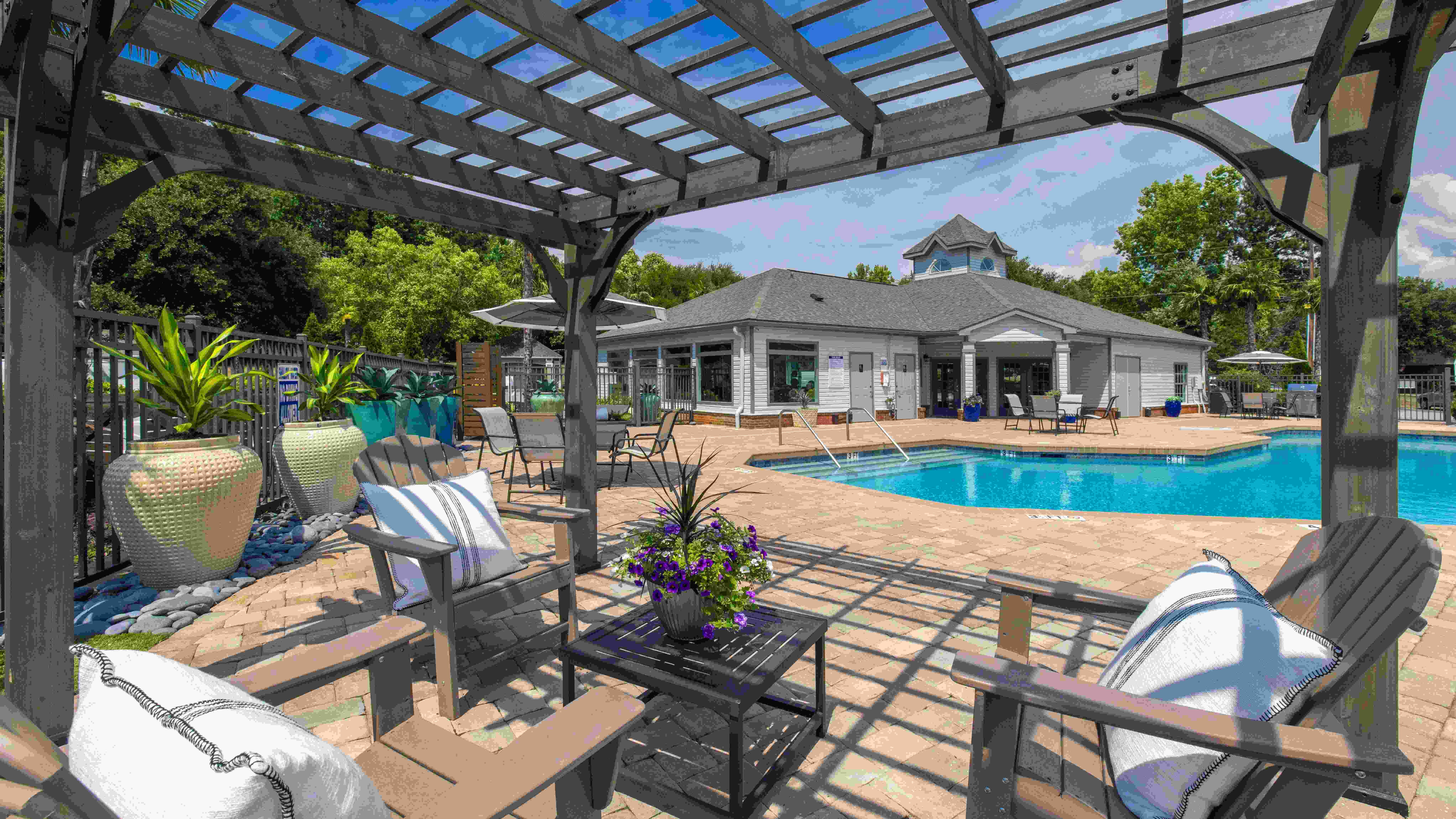 Relax under the poolside pergola for the best seat in the house.