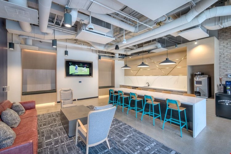 Chill lounge with seating, entertaining kitchen and flat screen television