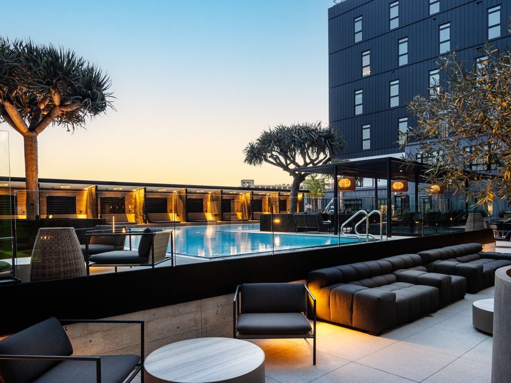 Poolside courtyard with multiple seating areas