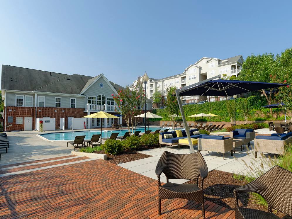 Swimming pool and sundeck with lounge seating