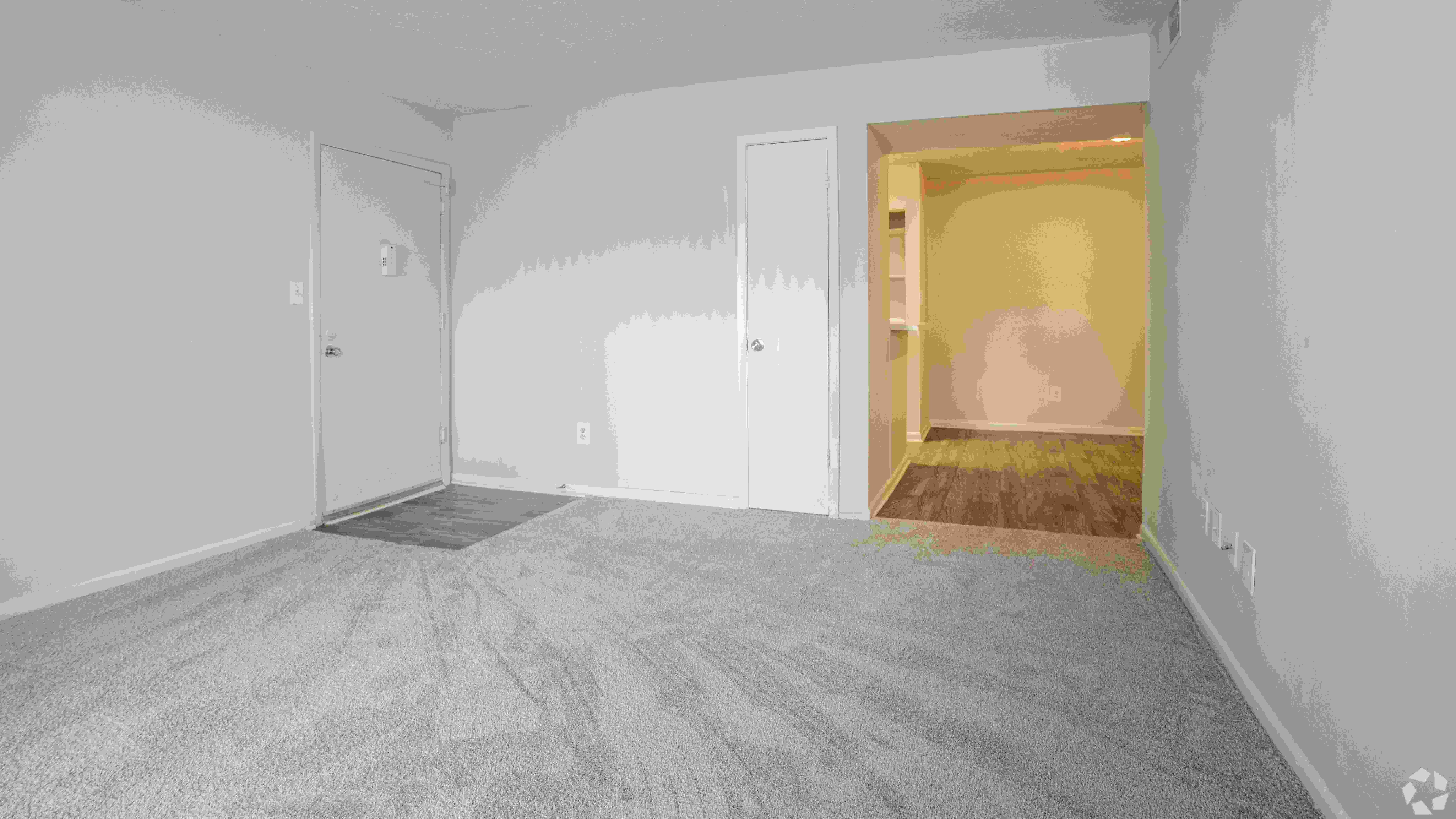 Spacious, open living room offering ample space and natural light for a comfortable living experience.