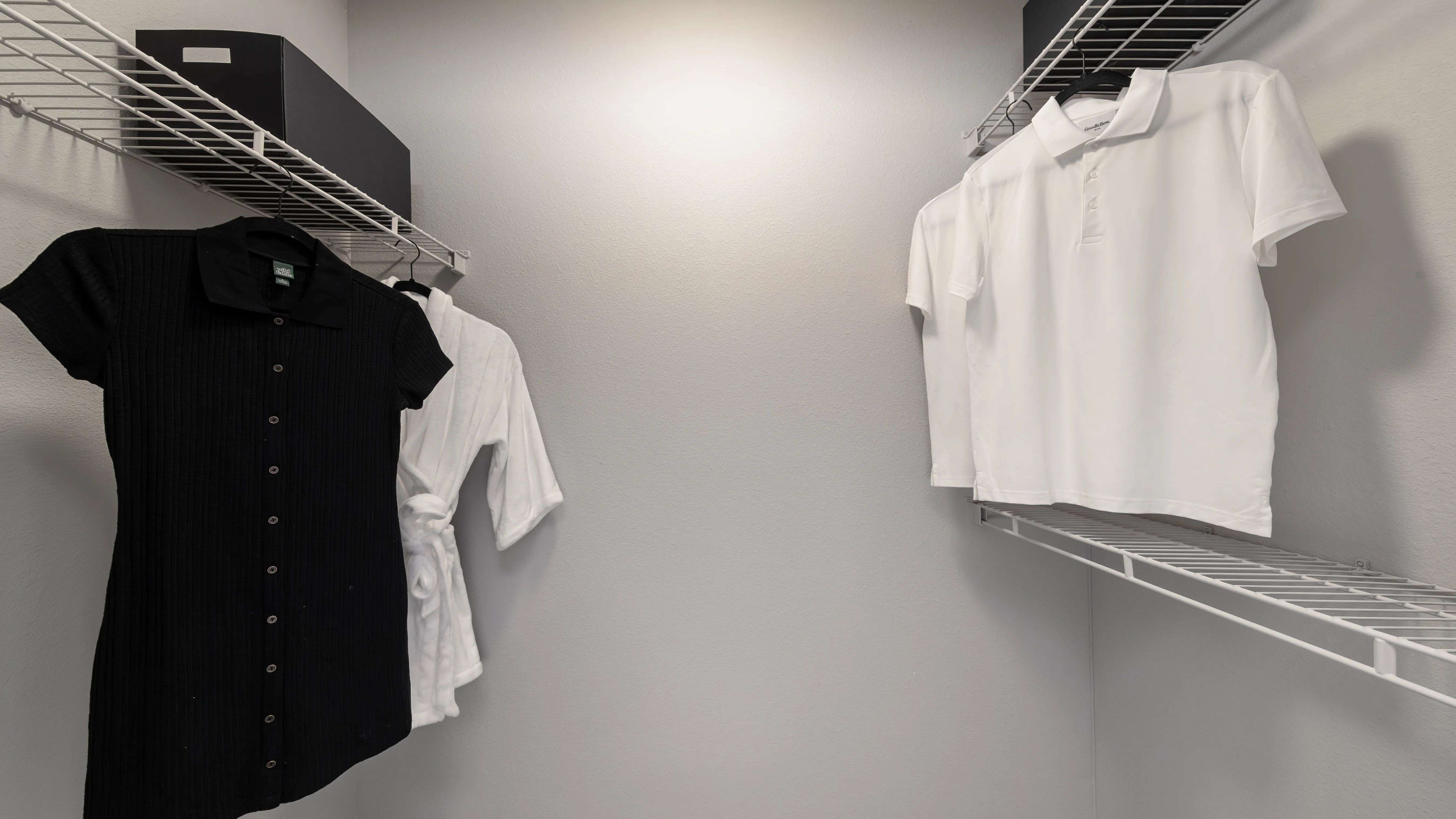 This spacious walk-in closet offers ample storage and organization options, perfect for keeping your wardrobe neat and accessible.