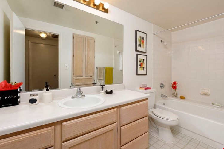 Classic Package I bath with white countertops and oak cabinetry