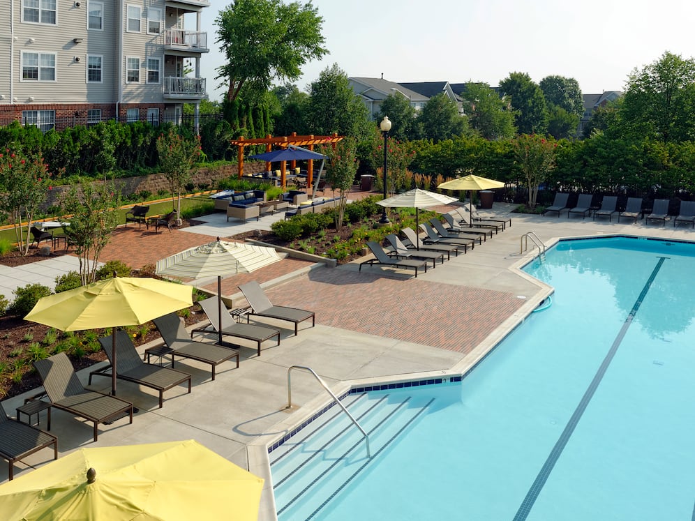 Swimming pool and sundeck with lounge seating