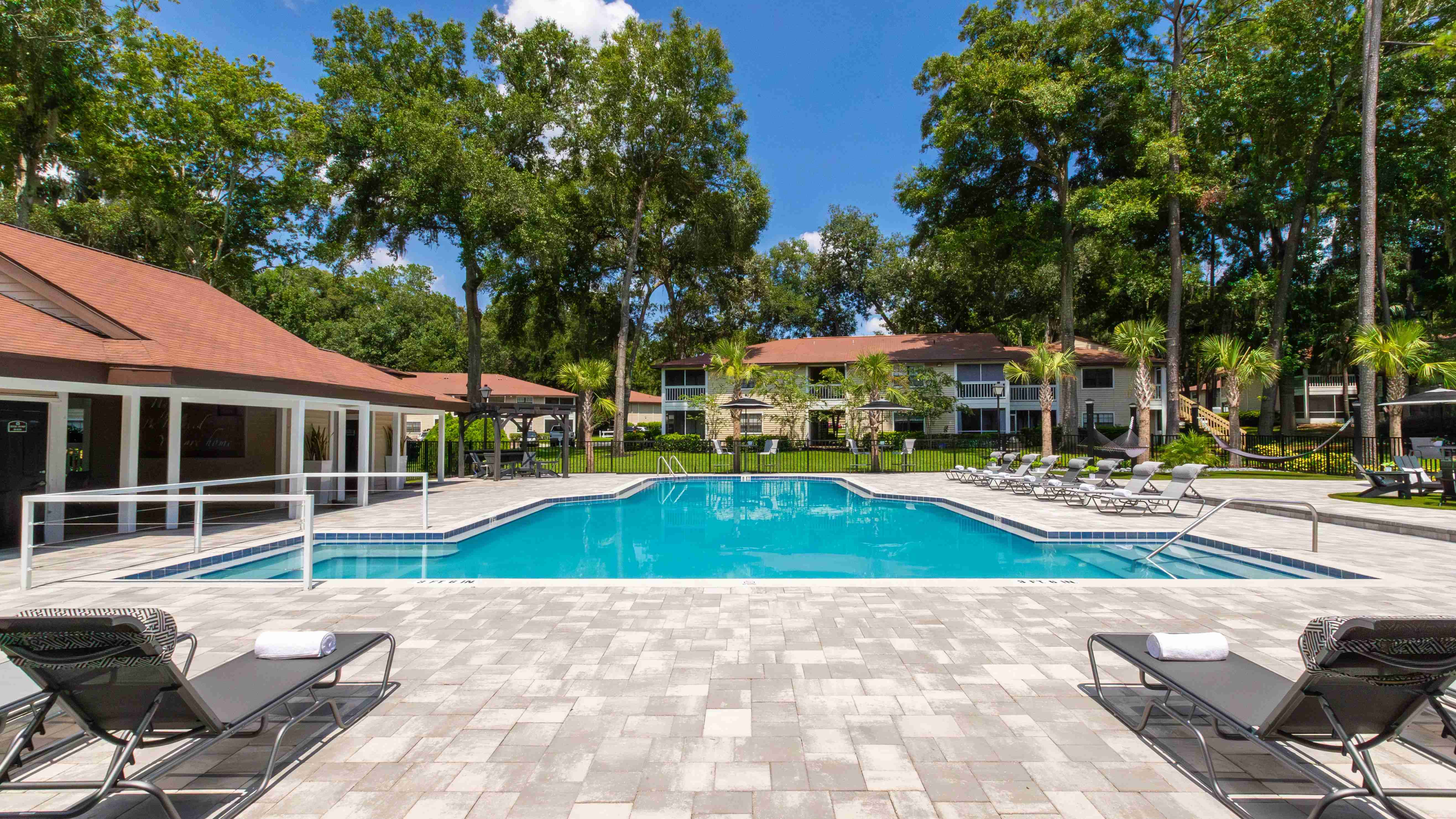 Our expansive sundeck promises endless fun with ample seating options, including loungers and tables.