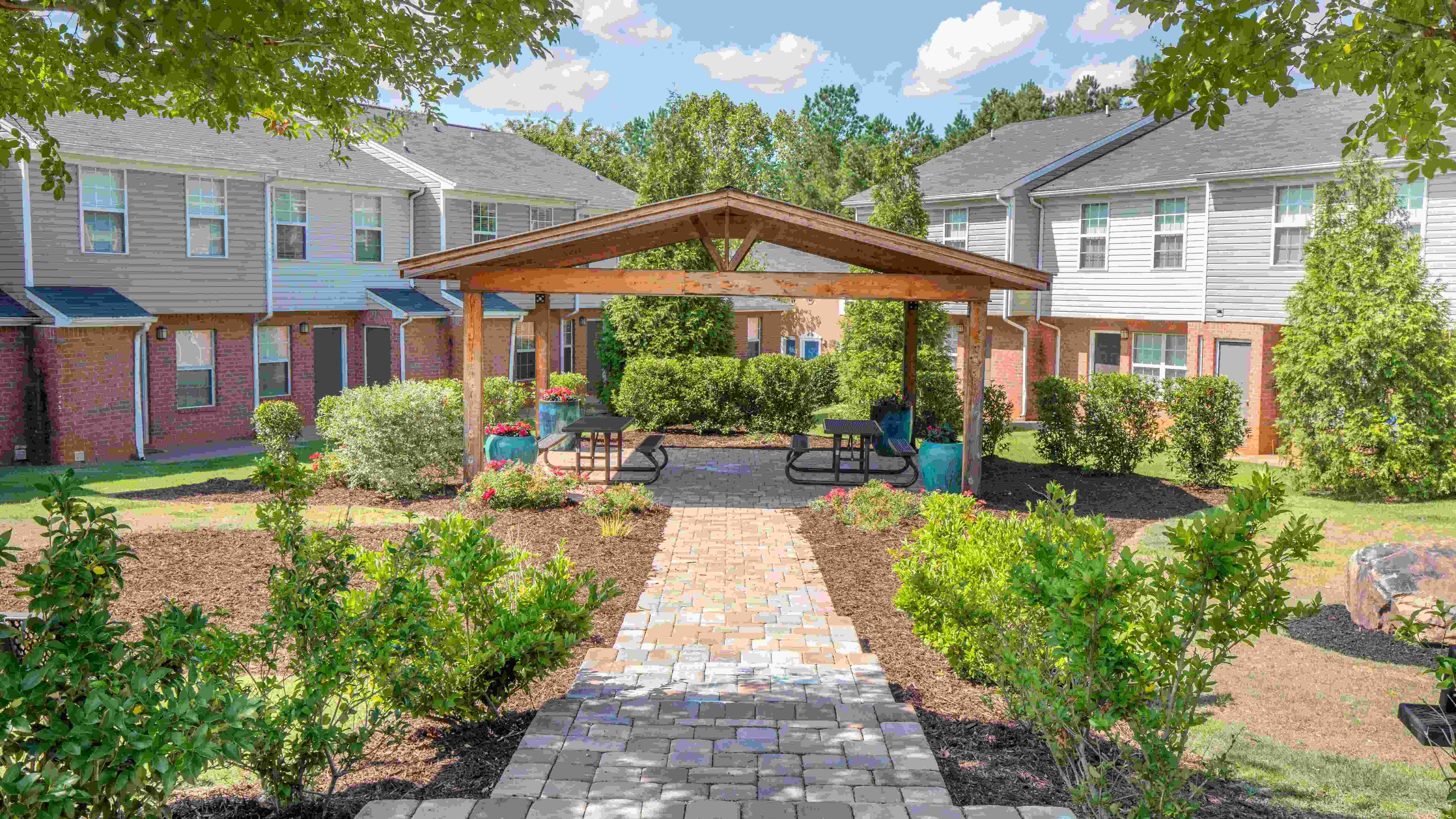 Stroll the inviting paved pathway to our picturesque picnic pavilion for outdoor feasts with friends. 