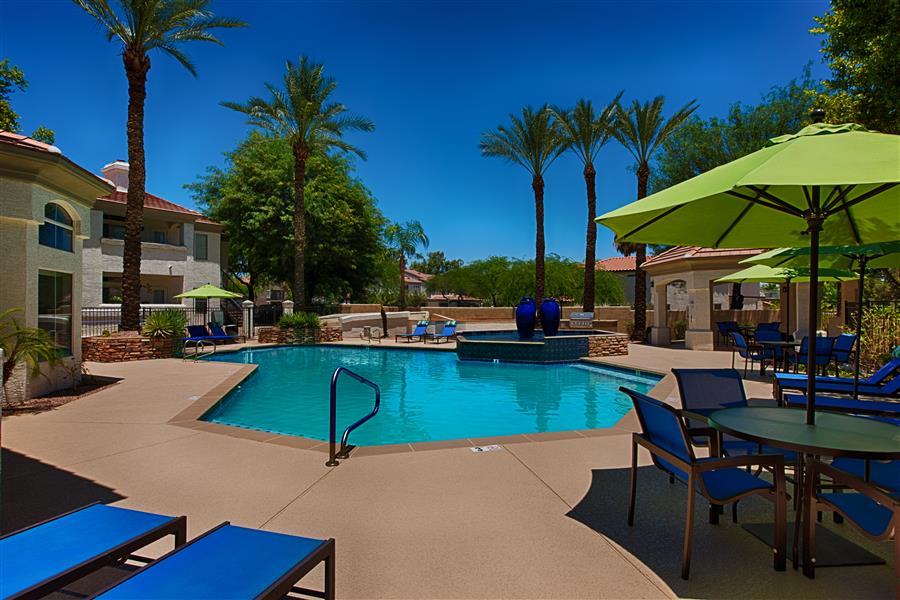 Swimming Pool with Umbrellas and Pool Furniture