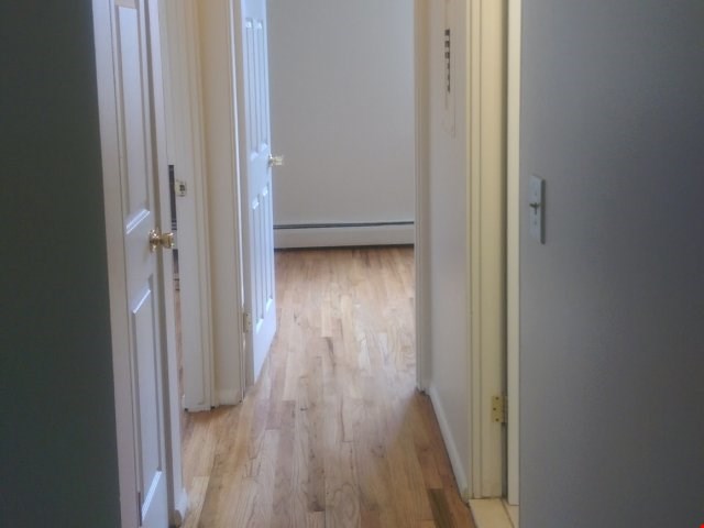 2 Bedroom Hall way w/ hardwood floors