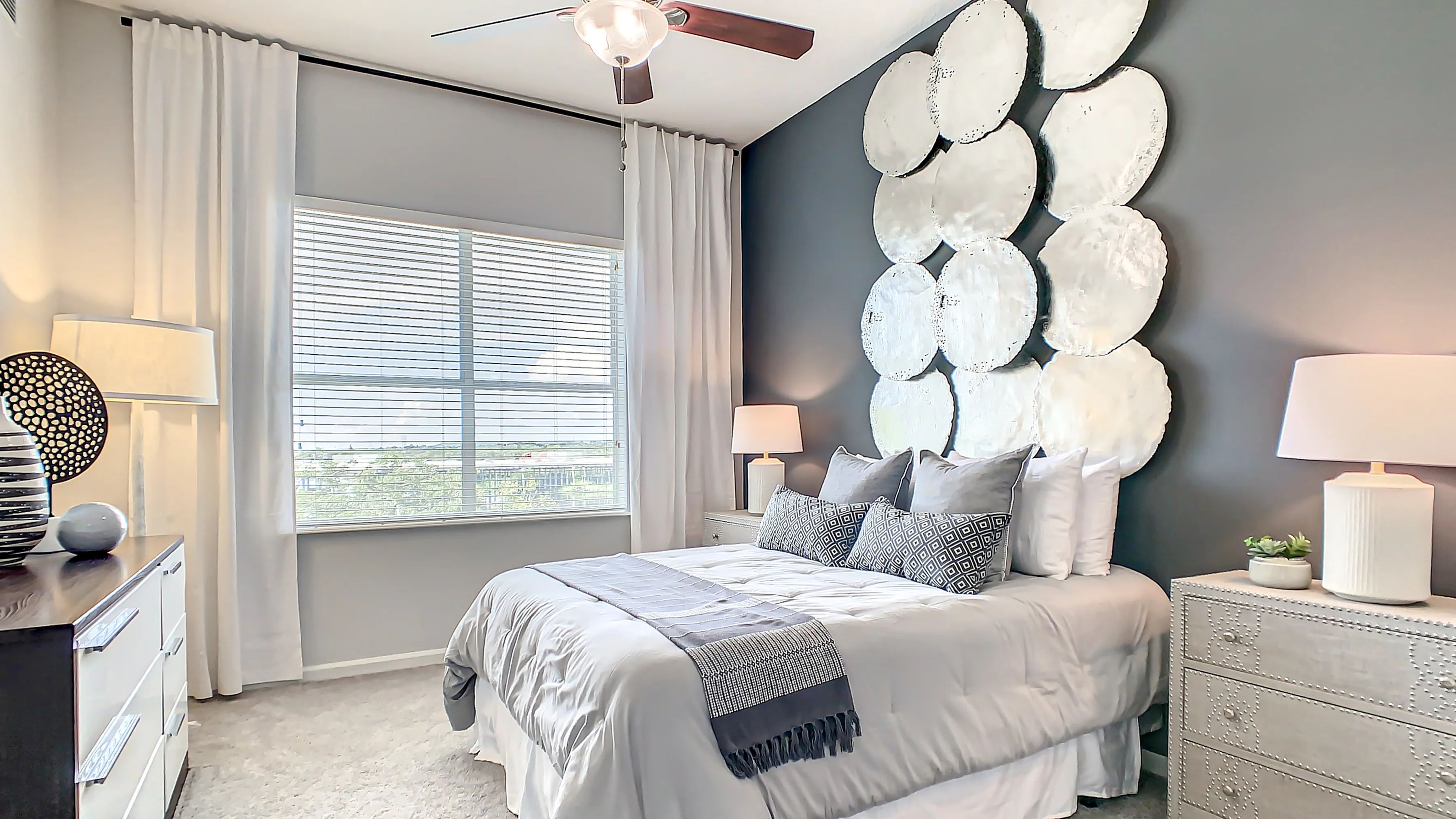  Enjoy cozy bedroom havens with large windows, plush carpeting, and lofty ceilings fostering an airy and serene ambiance, ideal for luxe relaxation. 