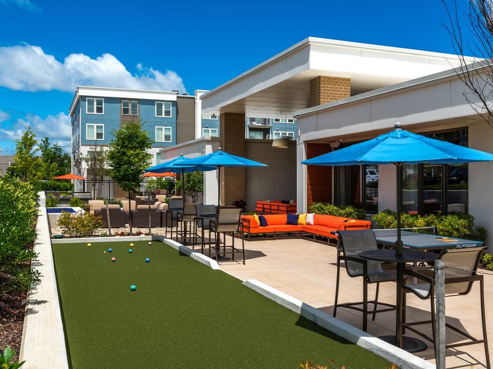Courtyard with lounge seating, ping-pong table and bocce pit