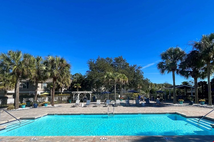 Immerse in the joy of our resort-style pool and expansive sundeck—a sunlit tropical paradise.