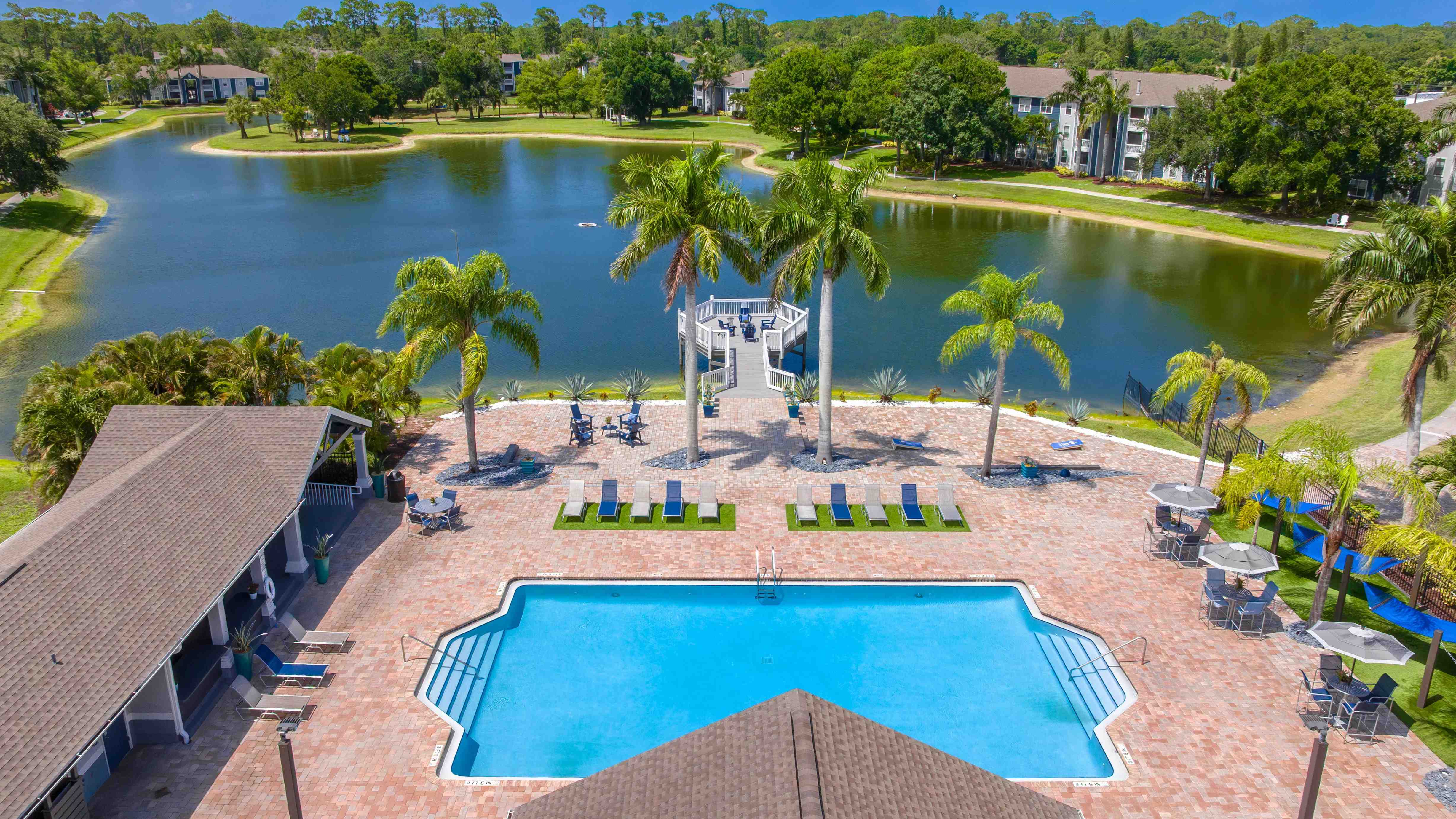 Soak up the sun by the pool or relax on the scenic dock—life at Grand Oaks blends luxury with laid-back lakefront charm.
