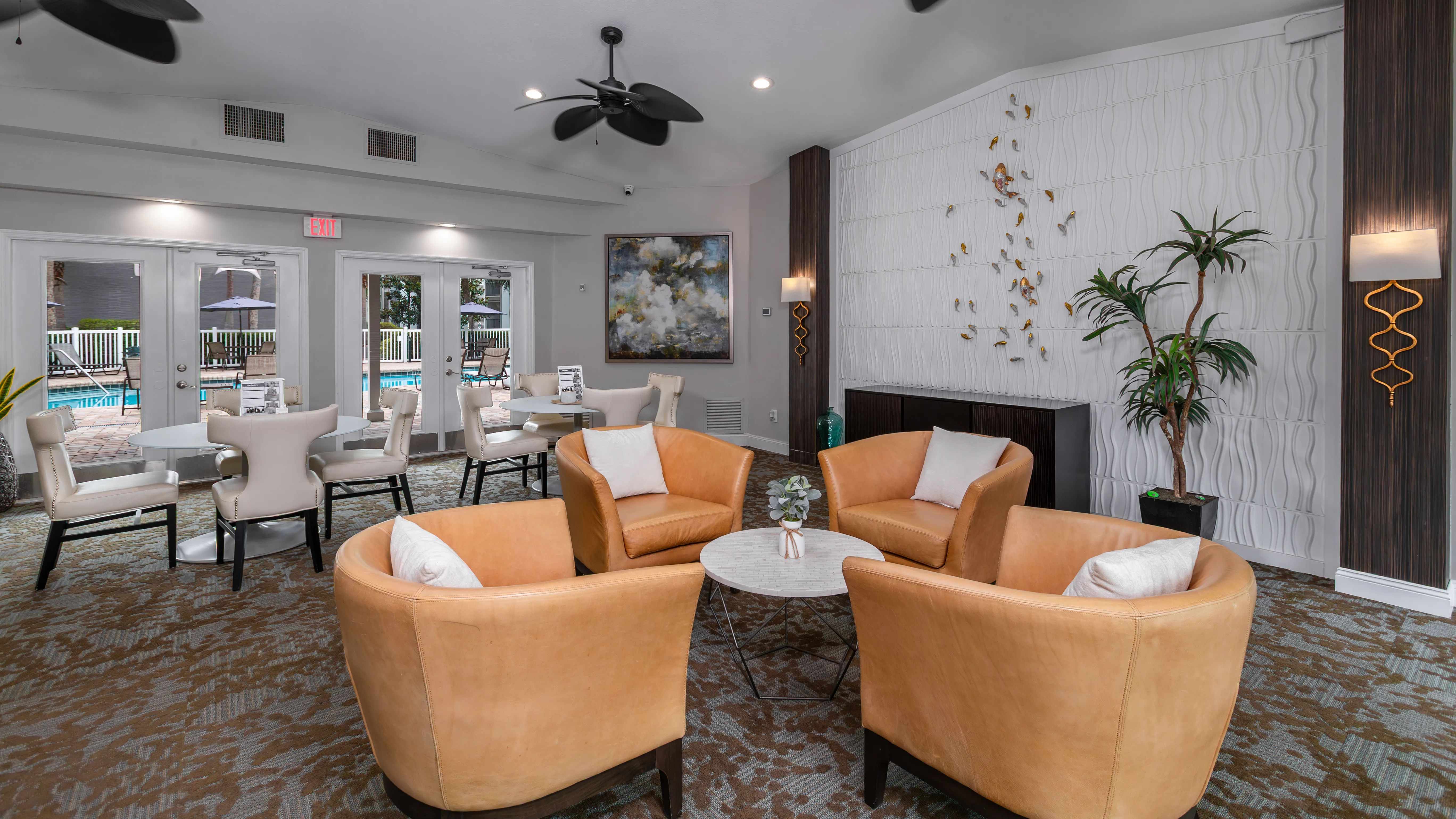 Enjoy a warm welcome in our modern leasing office, featuring elegant seating, contemporary decor, and views of the pool.