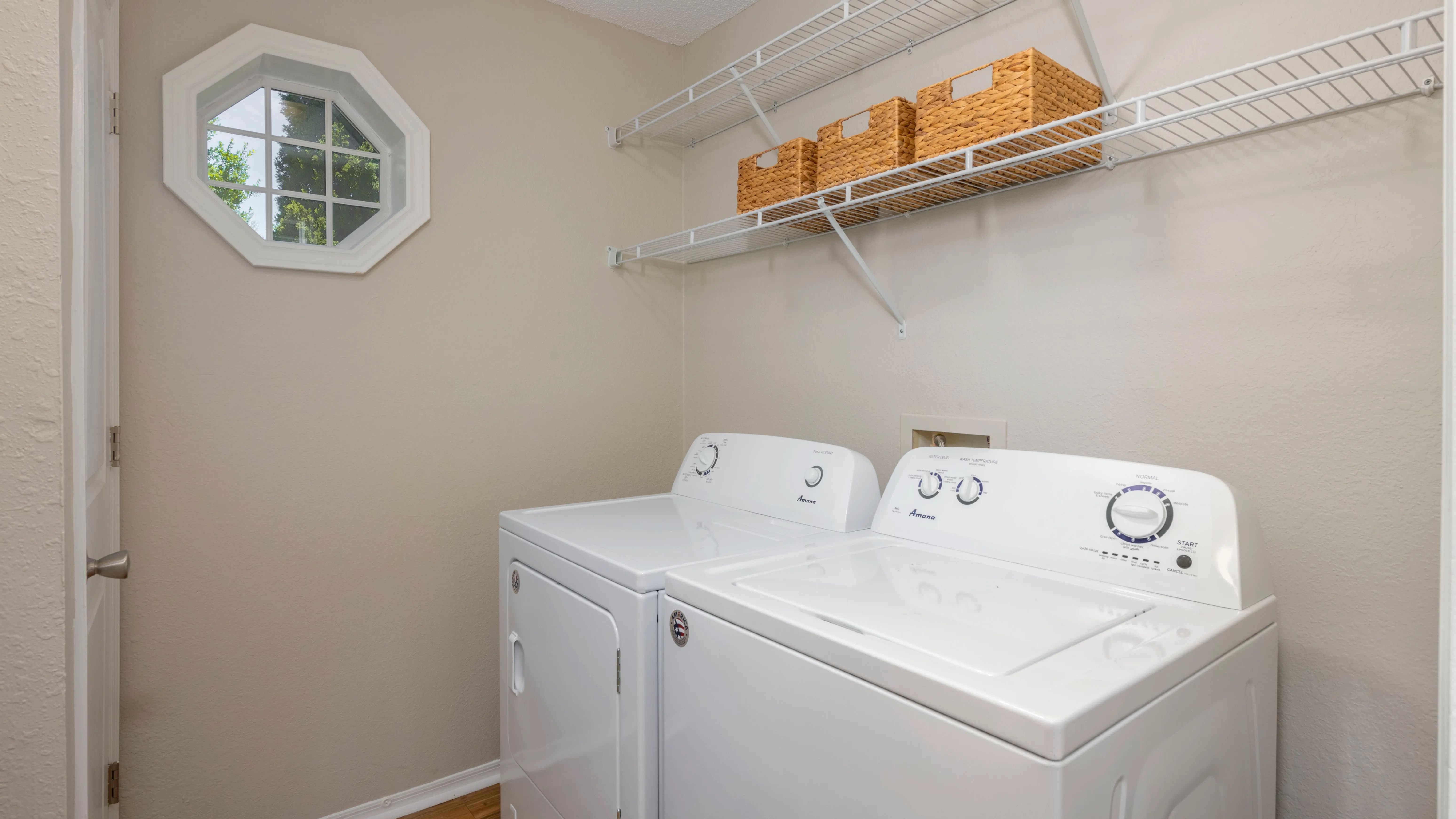 Feel the Laundry Room Vibe: Full-Size Washer, Dryer, and Ample Storage with Cheerful Natural Light, Making Laundry a Breeze!