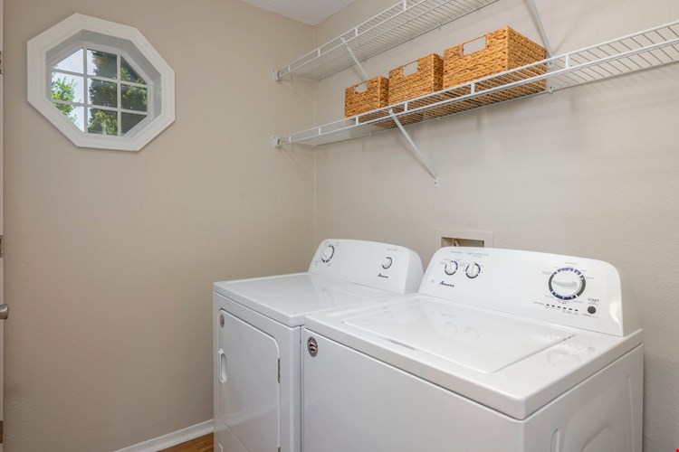 Feel the Laundry Room Vibe: Full-Size Washer, Dryer, and Ample Storage with Cheerful Natural Light, Making Laundry a Breeze!