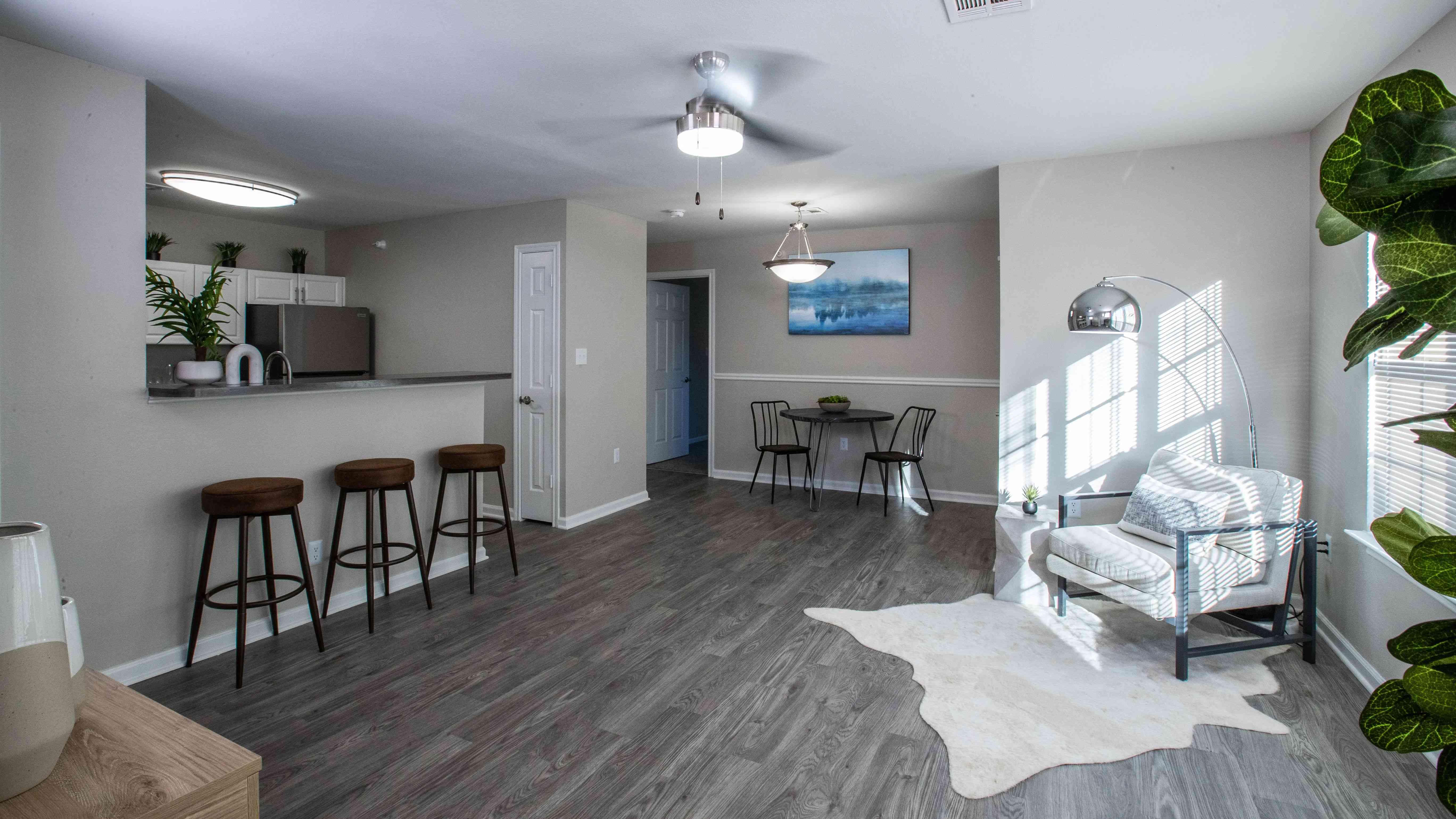 Enjoy the beauty of an uncluttered layout, where sunlight floods through the windows, and a modern, adjustable ceiling fan adds a touch of comfort. Your new apartment sanctuary awaits – where open space meets cozy elegance.