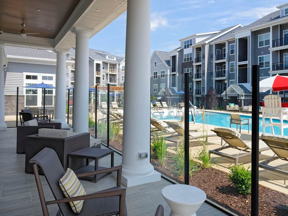 Courtyard swimming pool and sundeck with lounge seating
