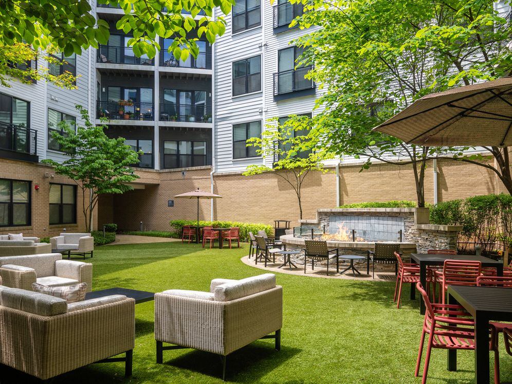 Courtyard with multiple seating areas and fire pit