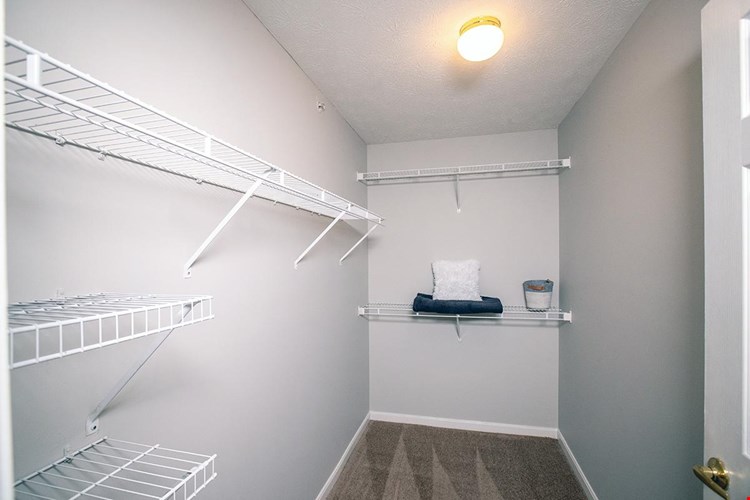Master bedrooms feature walk-in closets with built-in organizers.