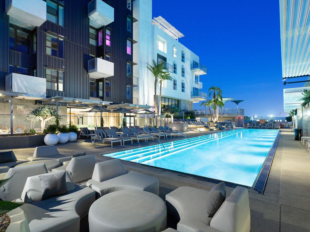 Pool and building exteriors at dusk