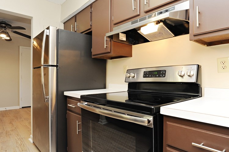 Kitchen features pantry and stainless steel appliances