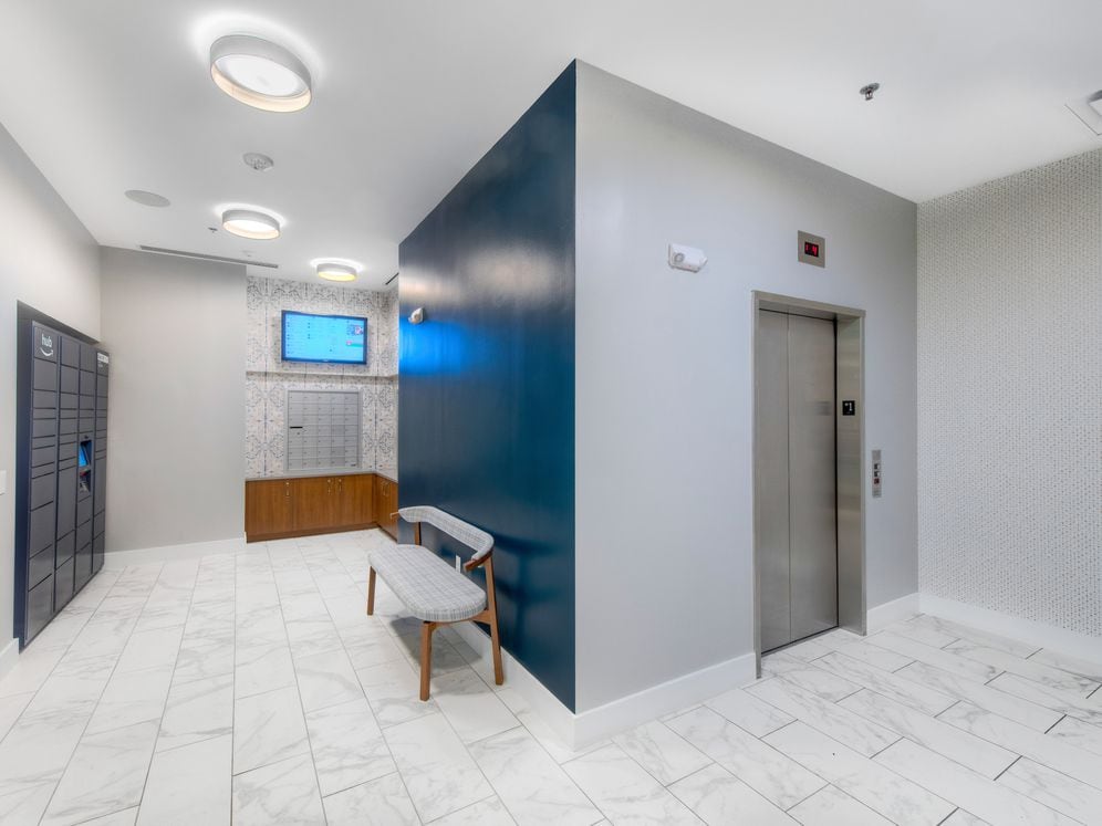2700 building lobby with Amazon HUB package locker system
