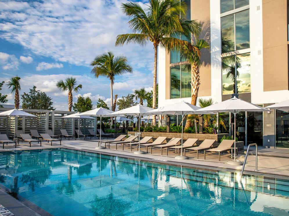 Infinity edge pool and sundeck with cabanas