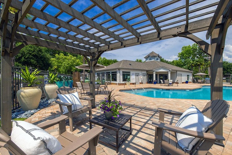 Relax in the shade under our poolside pergola.