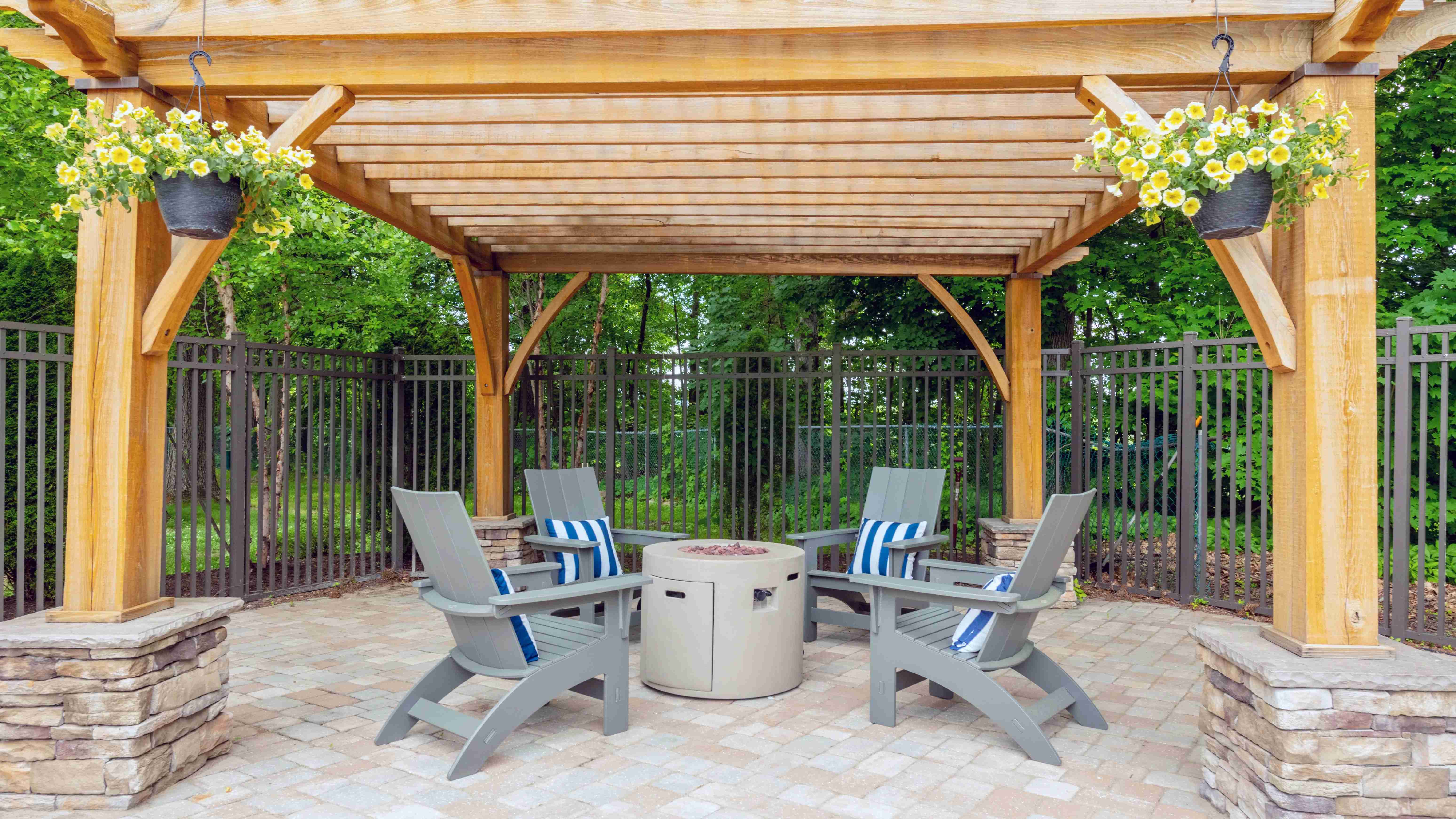Experience warmth by the pool at our fireside chill zone, complete with a stylish pergola offering protection from the elements and relaxing Adirondack seating.