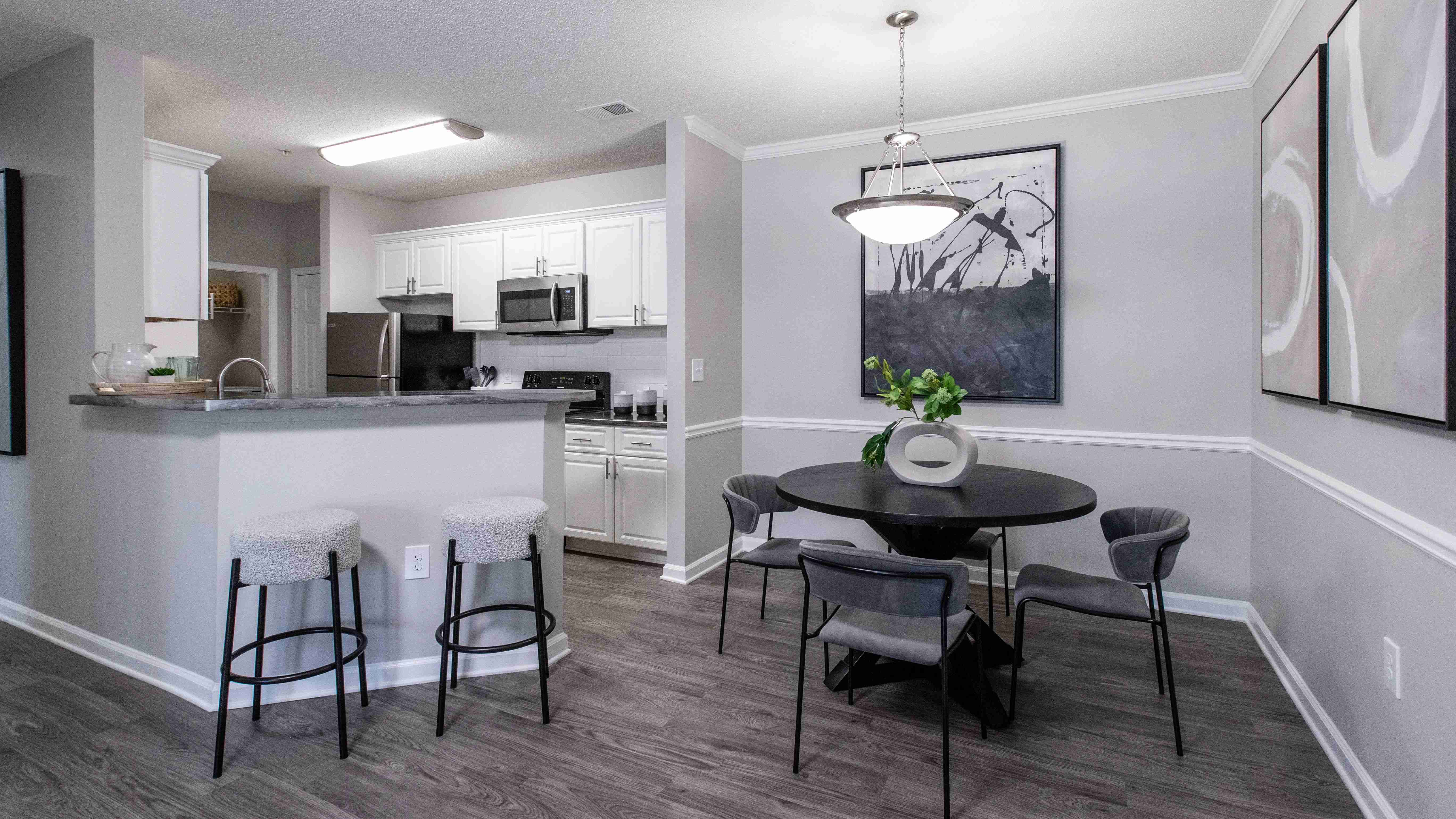 Savor formal meals in a cozy separate dining area adjacent to the modern kitchen or cozy up at the breakfast bar for quick-bit dining delights.   