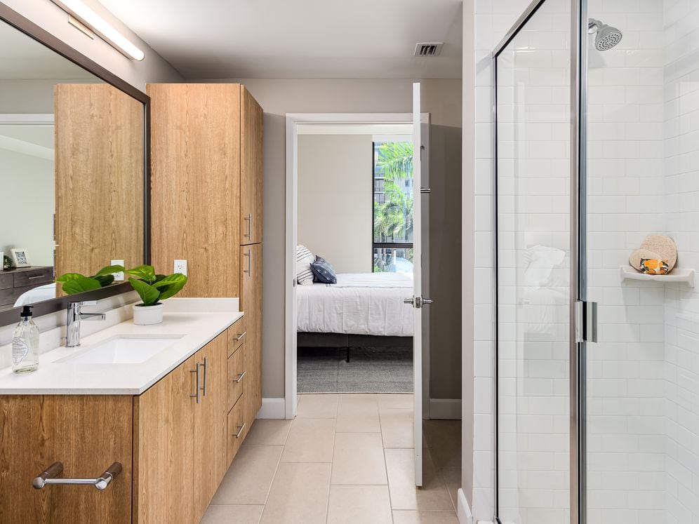 Spacious bathroom with quartz countertop and storage