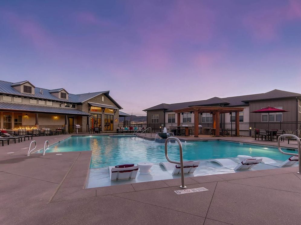 Swimming pool and sundeck with lounge seating