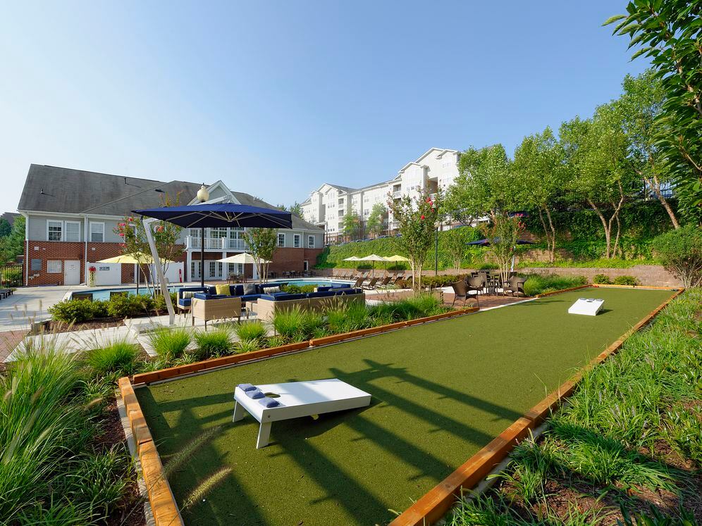 Courtyard with swimming pool, sundeck, lounge seating and outdoor gaming area