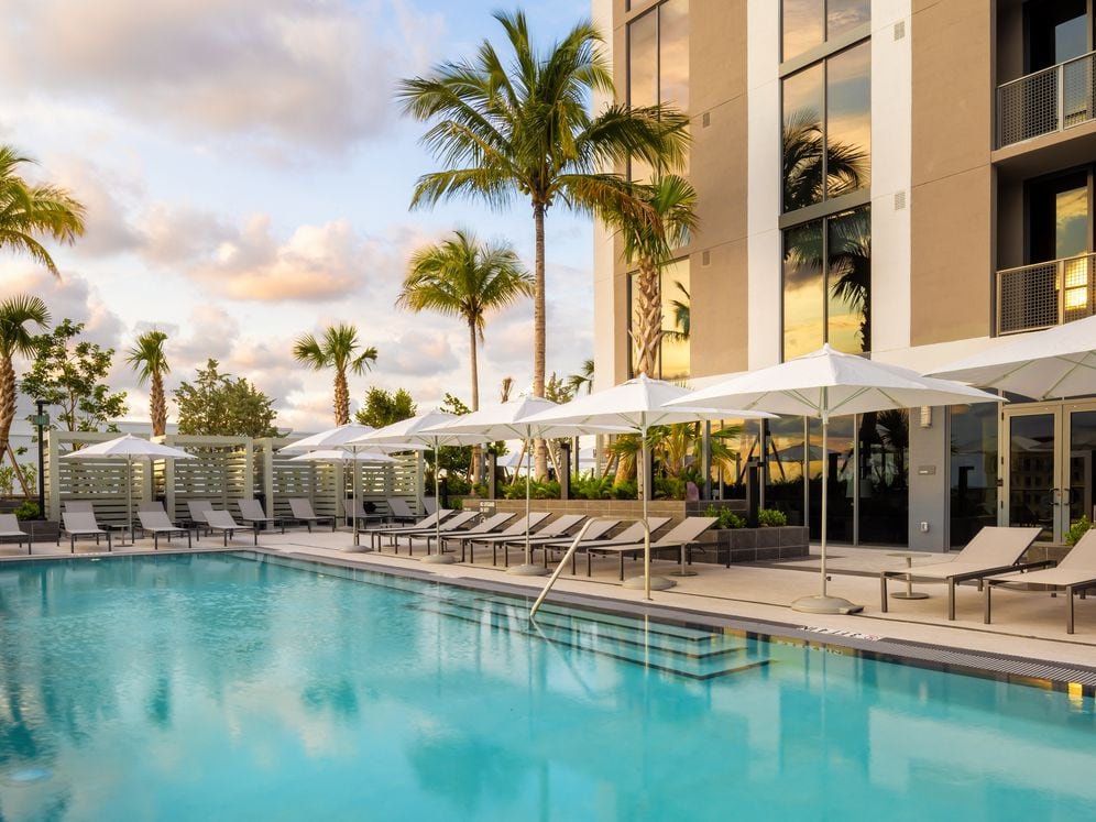 Infinity edge pool and sundeck with cabanas
