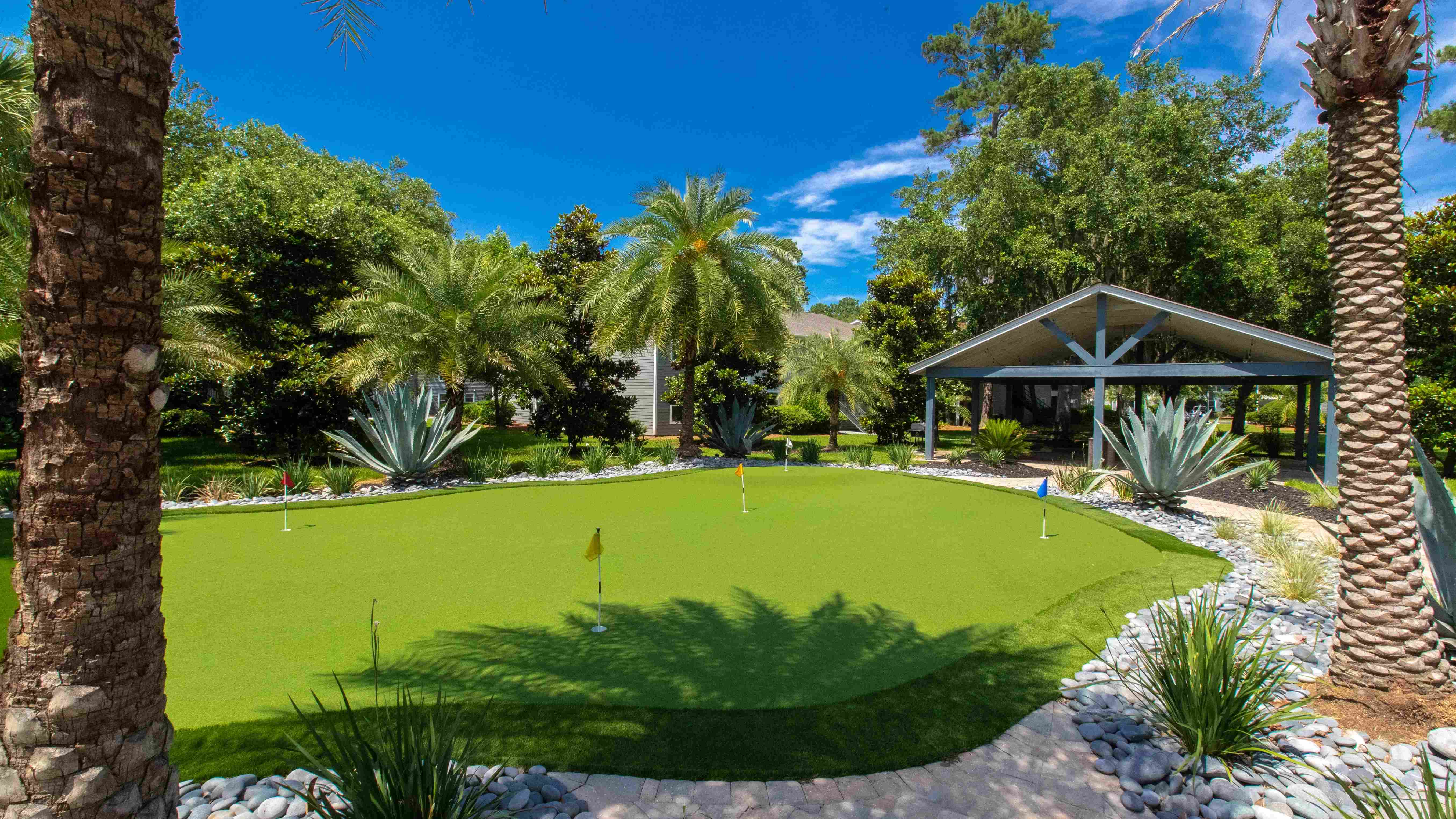 Calling all golf enthusiasts! Perfect your putt while enjoying the lush surroundings in our community before heading out to the courses at Hilton Head Island.