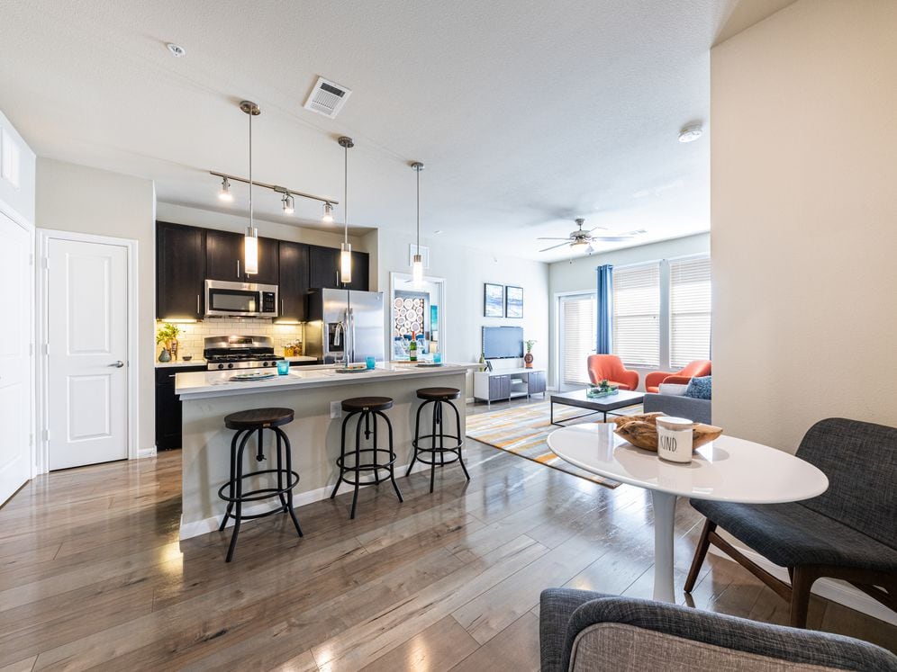 Kitchen, living, and dining area with hard surface flooring