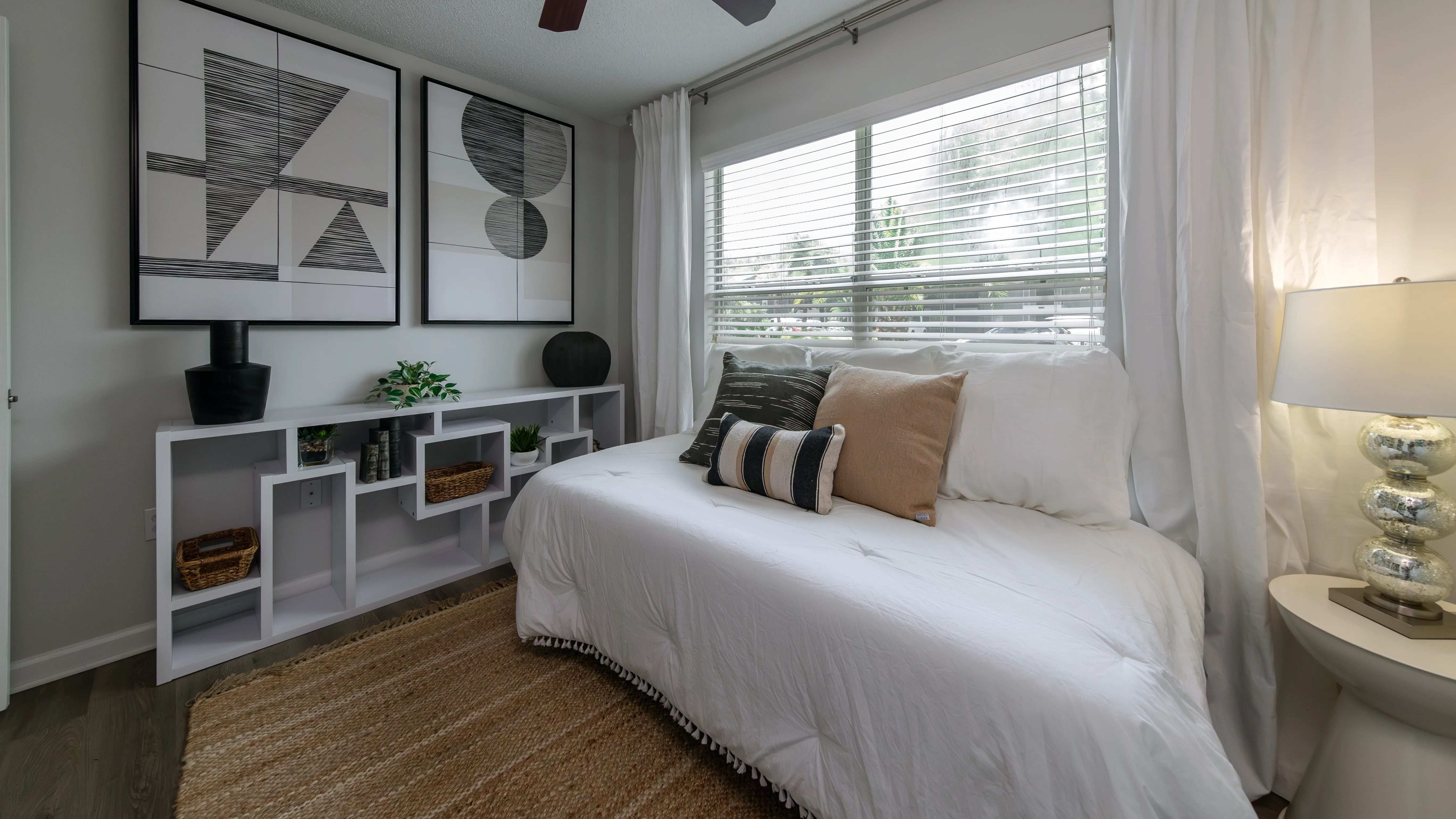 Wake up to the embrace of sunlight in this inviting bedroom at Emerson Isles. 