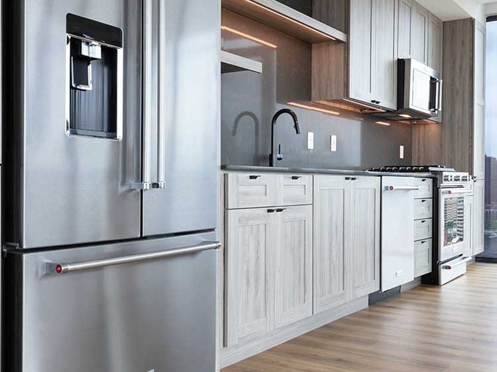 Penthouse-level Signature Collection apartment homes feature kitchens with upgraded appliances