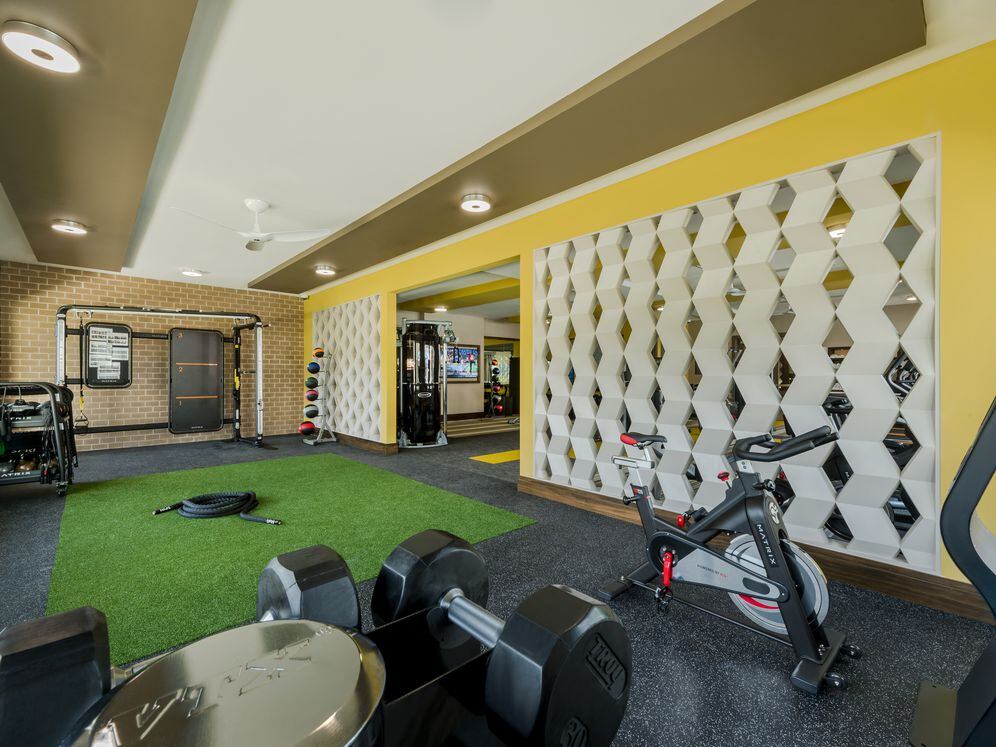 Fitness center with strength equipment and spin bike