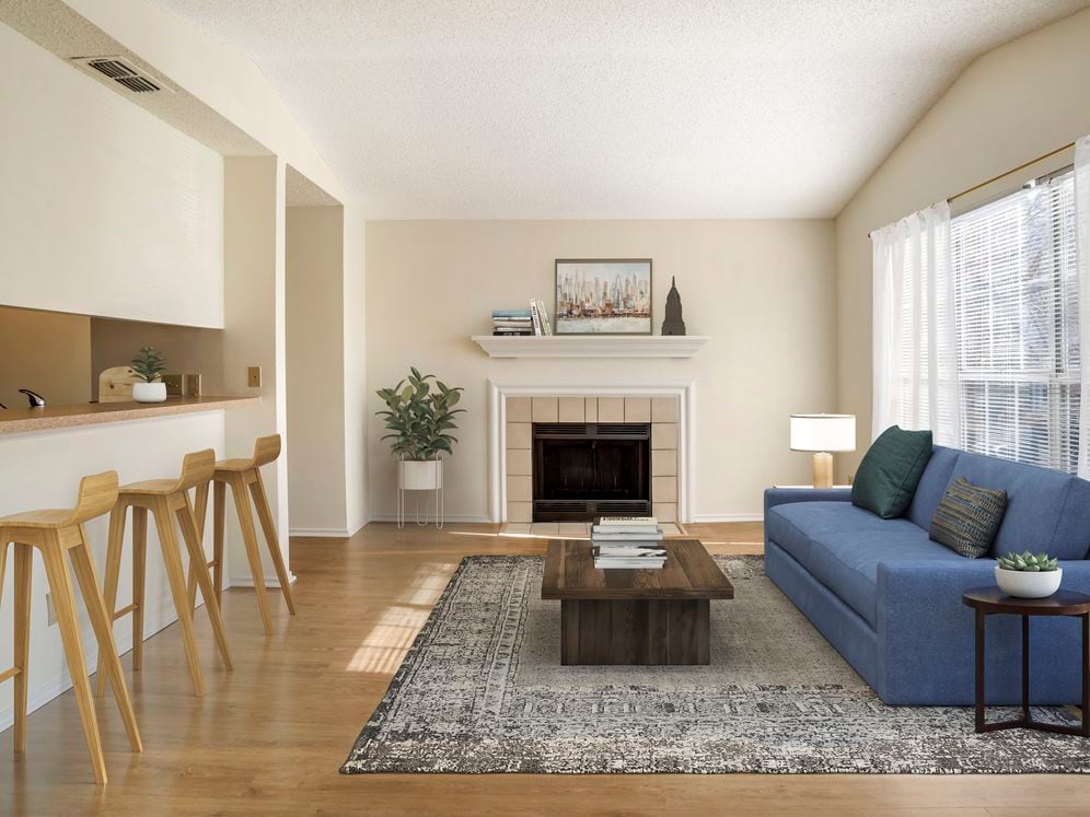 Renovated Package I kitchen and living area with hard surface flooring in common areas