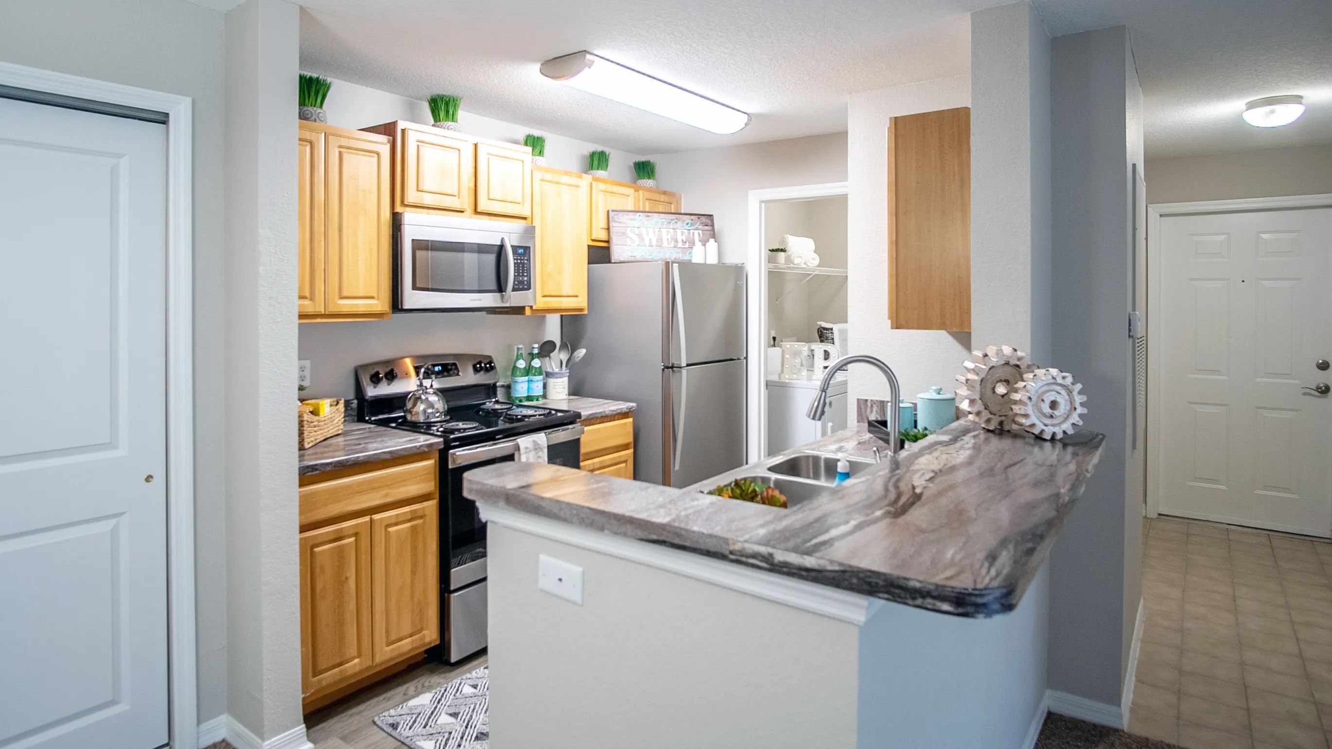 Embrace open-concept living at Eagle's Pointe, where the breakfast bar delightfully opens to the living area. 