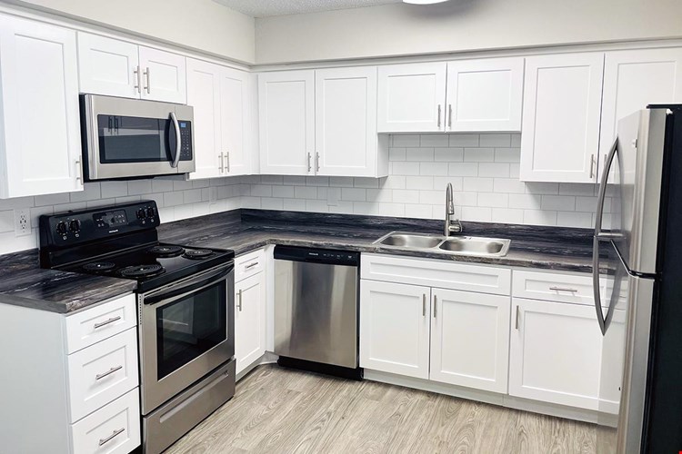 All floor plans feature stainless steel appliances in the kitchen.