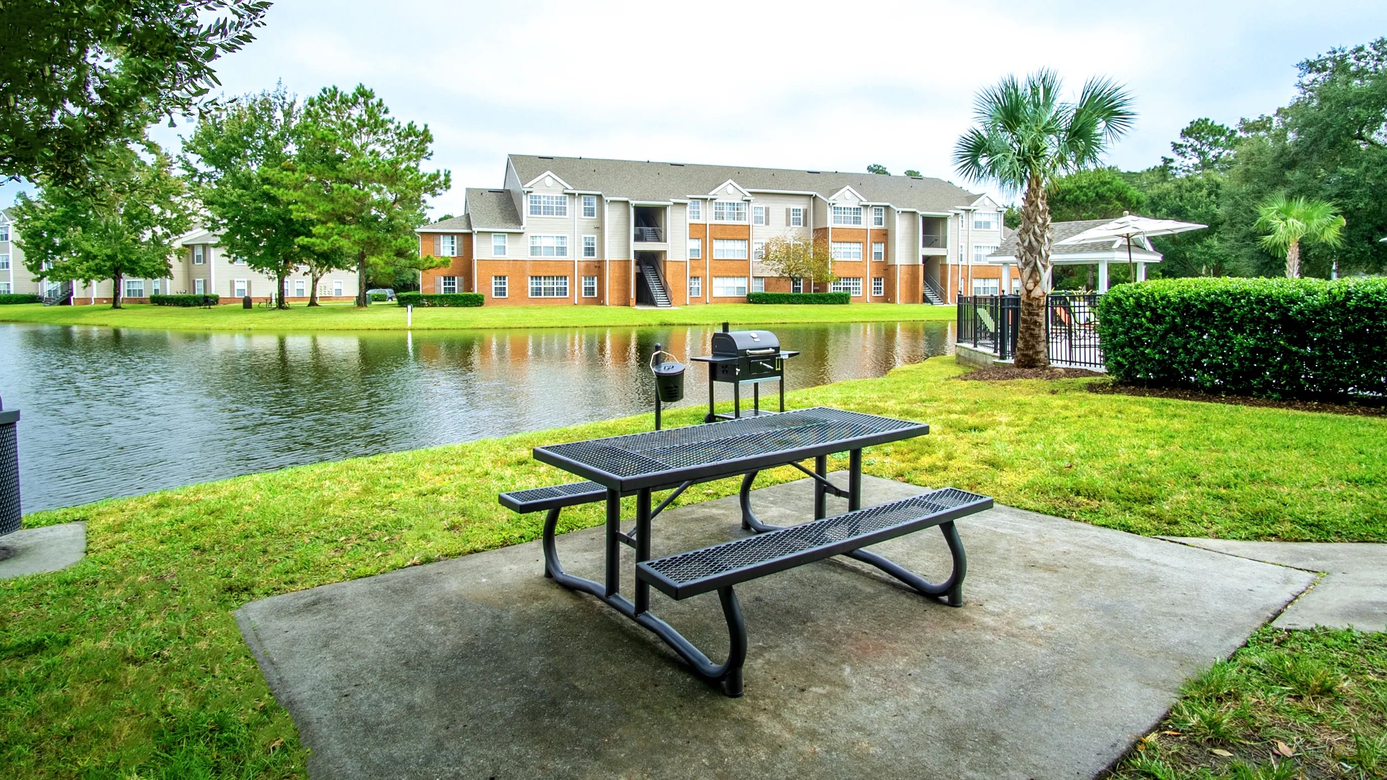 Relax and unwind at the serene picnic area at Eagles Pointe Apartments. Overlooking a peaceful lake, this spot features convenient grills and seating, perfect for enjoying outdoor meals and gatherings.