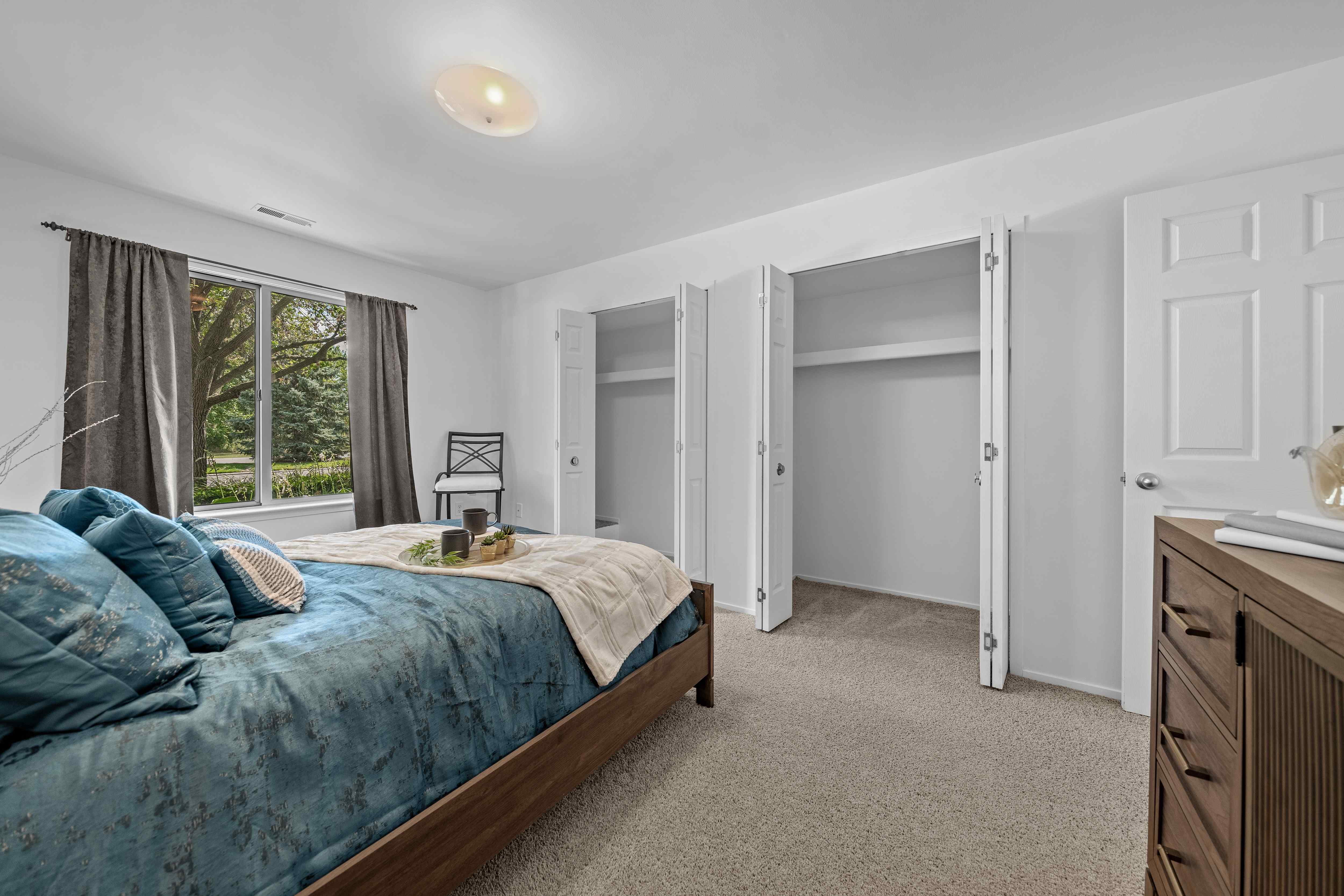 Bedroom with Ample storage space at Prentiss Pointe Apartments in Harrison Township, MI
