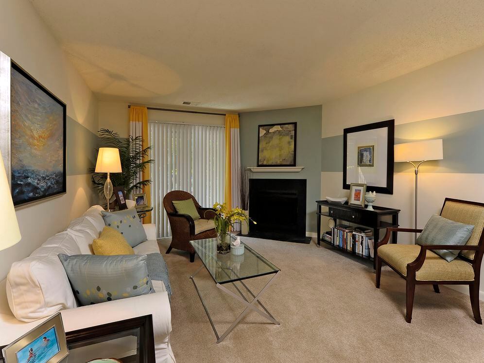 Classic Package II carpeted living area with fireplace