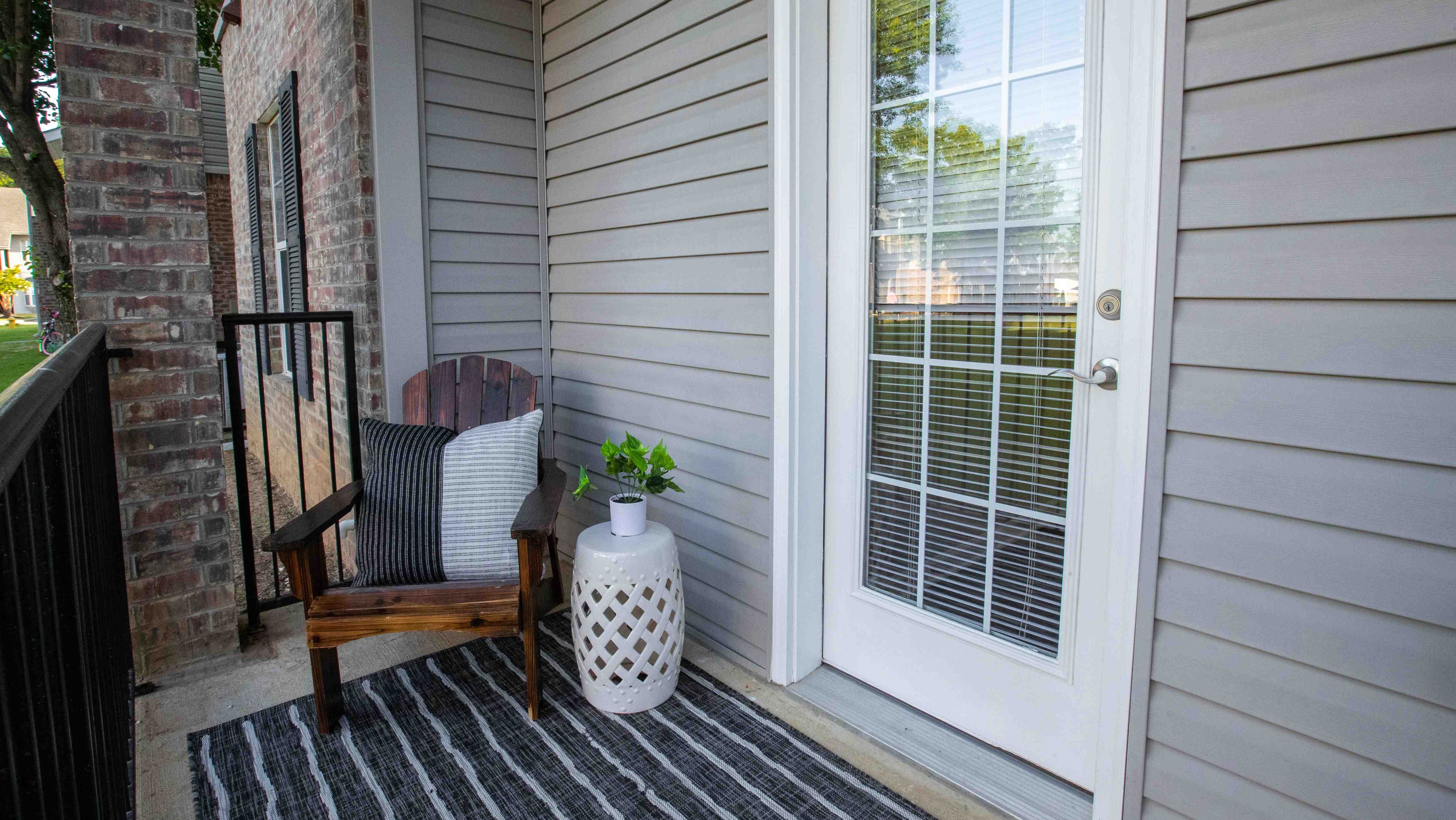 Step out to your private patio oasis, embellished with black wrought iron railing. It's a serene space perfect for a breath of fresh air.