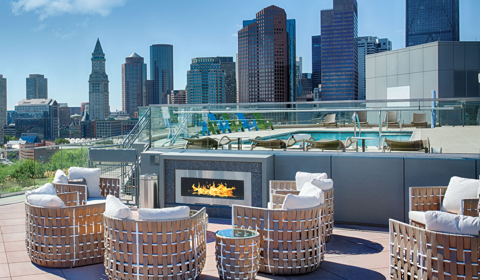 Warm up on breezy nights at the poolside fireplace lounge